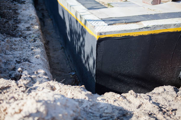 Professional Waterproofing technician working in Pineville, NC